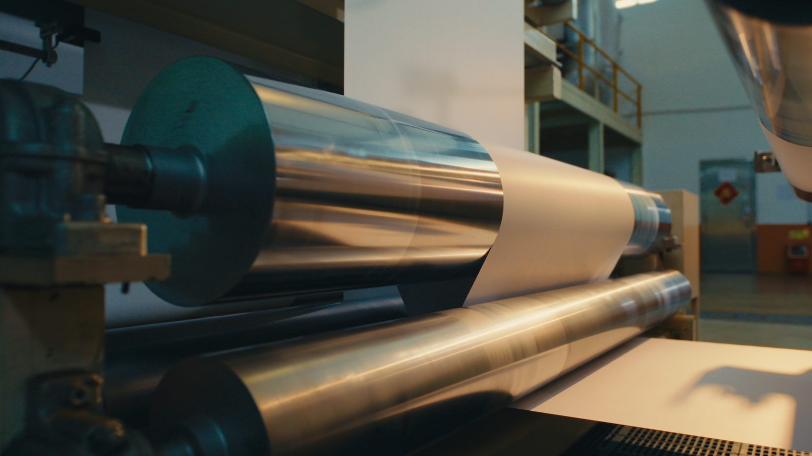 Calendar rollers with paper webbing